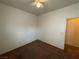 Bedroom with carpet flooring, a ceiling fan, and standard walls with neutral paint at 6165 Highland Gardens Dr, North Las Vegas, NV 89031