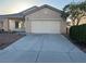 Charming single story home with attached two car garage and concrete driveway at 6165 Highland Gardens Dr, North Las Vegas, NV 89031