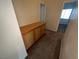 Hallway with cabinet storage and carpet flooring at 6165 Highland Gardens Dr, North Las Vegas, NV 89031