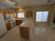 Bright kitchen with stainless appliances, ample cabinetry, and an island with breakfast bar at 6165 Highland Gardens Dr, North Las Vegas, NV 89031