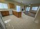Modern kitchen featuring an island, tile floors, and plenty of natural light from the surrounding windows at 6165 Highland Gardens Dr, North Las Vegas, NV 89031