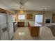 Updated kitchen with an island, stainless steel appliances, tile floors, and bright lighting at 6165 Highland Gardens Dr, North Las Vegas, NV 89031