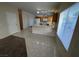 Bright kitchen area with tile floors, white appliances, and a breakfast bar for casual dining at 6165 Highland Gardens Dr, North Las Vegas, NV 89031