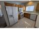 Modern kitchen with stainless steel appliances and light-colored wood cabinets with matching countertops at 6165 Highland Gardens Dr, North Las Vegas, NV 89031