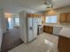 Updated kitchen with an island, stainless steel appliances, tile floors, and bright lighting at 6165 Highland Gardens Dr, North Las Vegas, NV 89031