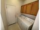 Laundry room featuring cabinets and standard white washer and dryer appliances at 6165 Highland Gardens Dr, North Las Vegas, NV 89031