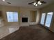 The living room showcases tile and carpet flooring, a fireplace, and French patio doors at 6165 Highland Gardens Dr, North Las Vegas, NV 89031