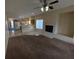 Inviting living room showing fireplace, adjoined eat-in kitchen and lots of open space at 6165 Highland Gardens Dr, North Las Vegas, NV 89031