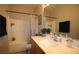 Clean bathroom featuring a vanity with sink, shower over tub, and neutral color palette at 6437 Boatbill St, North Las Vegas, NV 89084