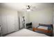 Bedroom with ceiling fan, two beds, and carpet, creating a comfortable and functional shared space at 6437 Boatbill St, North Las Vegas, NV 89084