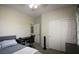 Comfortable bedroom includes a desk, double door closet, and a neutral color scheme, offering a peaceful retreat at 6437 Boatbill St, North Las Vegas, NV 89084