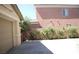 View of the detached garage and surrounding backyard at 6437 Boatbill St, North Las Vegas, NV 89084