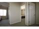 Hallway showcasing access to carpeted bedrooms, providing privacy and separation of living spaces at 6437 Boatbill St, North Las Vegas, NV 89084