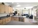Open kitchen flows to living space, featuring bar seating and modern appliances at 6437 Boatbill St, North Las Vegas, NV 89084