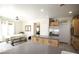 Spacious kitchen with a large island, stainless steel refrigerator, and dining area at 6437 Boatbill St, North Las Vegas, NV 89084