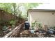 Backyard with a retaining wall and lush foliage at 6437 Boatbill St, North Las Vegas, NV 89084