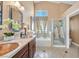 Bathroom with double sinks, tub, and standing shower for a spa-like retreat at 688 Quiet Stream Ct, Henderson, NV 89052
