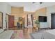 Expansive Primary suite featuring wood floors, a work area, and access to ensuite bathroom at 688 Quiet Stream Ct, Henderson, NV 89052