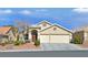 Charming single-story home featuring a two-car garage and a well-maintained landscaped front yard at 688 Quiet Stream Ct, Henderson, NV 89052