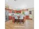 Kitchen island with breakfast bar and stainless steel refrigerator at 688 Quiet Stream Ct, Henderson, NV 89052