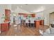 Bright kitchen featuring stainless steel appliances, wood cabinets, tile floors and a breakfast bar at 688 Quiet Stream Ct, Henderson, NV 89052