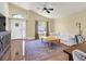 Cozy living room with hardwood floors, vaulted ceilings, and neutral decor at 688 Quiet Stream Ct, Henderson, NV 89052