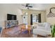 Bright living room featuring hardwood floors, vaulted ceilings, and a large window at 688 Quiet Stream Ct, Henderson, NV 89052