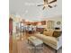 Open-concept living room with kitchen featuring stainless steel appliances at 688 Quiet Stream Ct, Henderson, NV 89052