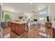 Bright, open-concept kitchen and living area with hardwood floors at 688 Quiet Stream Ct, Henderson, NV 89052