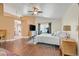 Spacious bedroom with wood look tile flooring, access to the backyard, and decorative furnishings at 688 Quiet Stream Ct, Henderson, NV 89052