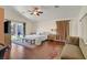 Well-lit bedroom with a sliding door to the backyard, ceiling fan, and decorative furnishings at 688 Quiet Stream Ct, Henderson, NV 89052