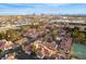 Residential area with single-story houses with red tile roofs against the city skyline at 726 Sea Pines Ln, Las Vegas, NV 89107