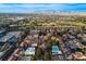 Golf course and residential area with mountain views and a cityscape in the distance at 726 Sea Pines Ln, Las Vegas, NV 89107