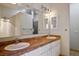 Double vanity bathroom with neutral tile and granite countertops at 726 Sea Pines Ln, Las Vegas, NV 89107