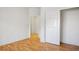 Bright bedroom featuring laminate floors, fresh paint, and a closet at 726 Sea Pines Ln, Las Vegas, NV 89107