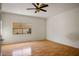 Bright room with laminate floors and a modern ceiling fan at 726 Sea Pines Ln, Las Vegas, NV 89107