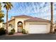 Home's exterior showcasing the garage, front door, and tiled roof at 726 Sea Pines Ln, Las Vegas, NV 89107