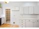 Kitchen featuring white cabinets, and a spacious pantry for organized storage at 726 Sea Pines Ln, Las Vegas, NV 89107