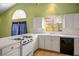 Kitchen featuring tile countertops, white appliances, and large window offering plenty of natural light at 726 Sea Pines Ln, Las Vegas, NV 89107