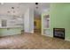 Spacious living room with fireplace and views into the kitchen area at 726 Sea Pines Ln, Las Vegas, NV 89107