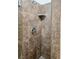 Tiled shower with installed shelf and chrome shower head fixture in bathroom at 726 Sea Pines Ln, Las Vegas, NV 89107