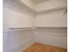 Walk-in closet with custom shelves, and laminate floors at 726 Sea Pines Ln, Las Vegas, NV 89107