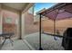 View of the backyard featuring a covered patio area, rock landscaping and privacy wall at 7530 Brisa Del Mar Ave, Las Vegas, NV 89179