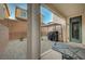 View of the backyard featuring a covered patio area, rock landscaping and privacy wall at 7530 Brisa Del Mar Ave, Las Vegas, NV 89179