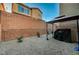 Low maintenance backyard with decorative rock, privacy wall and a covered grill at 7530 Brisa Del Mar Ave, Las Vegas, NV 89179