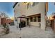 Spacious backyard with covered patio area, rock landscaping and privacy wall at 7530 Brisa Del Mar Ave, Las Vegas, NV 89179