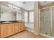 Primary bathroom with dual sinks, soaking tub and glass shower at 7530 Brisa Del Mar Ave, Las Vegas, NV 89179