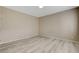 Neutral bedroom featuring wood-look flooring at 7530 Brisa Del Mar Ave, Las Vegas, NV 89179