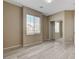 Bedroom with a closet with mirrored doors and a window for natural light at 7530 Brisa Del Mar Ave, Las Vegas, NV 89179