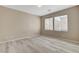 Cozy bedroom with wood-look flooring and bright, natural light at 7530 Brisa Del Mar Ave, Las Vegas, NV 89179